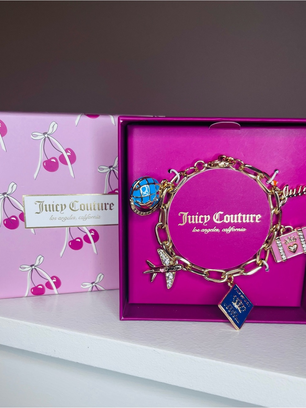 Juicy Couture Gold-Tone Charm Bracelet with Blue Enamel Accents